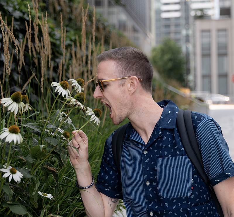 Ryan Robinson pretending to eat a flower